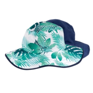 Sun hat with tropical leaf pattern on a white background